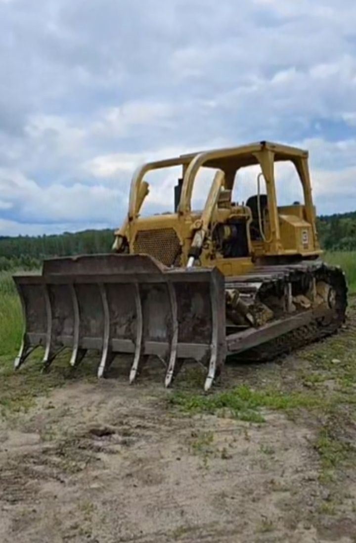 Land clearing bulldozer with rake blade for excavation contractor Fergus Falls, MN