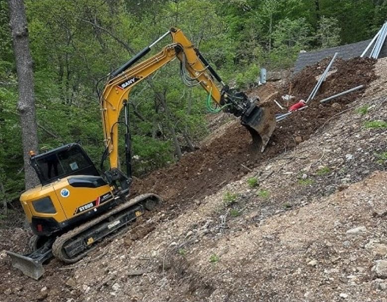 Sany SY80U compact excavator grading a slope near Fergus Falls, MN